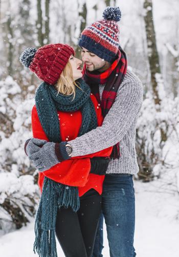 Couple on Kashmir Tour Package Enjoying Snow in Gulmarg